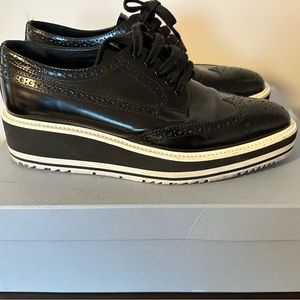 Prada brogue shoes black leather with white sole. Barely worn